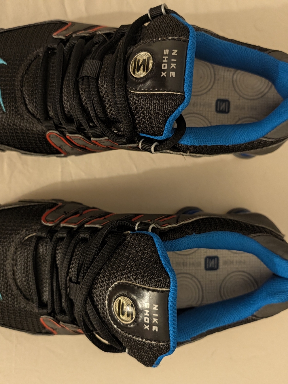 Nike Shox NZ Women’s Black Athletic Shoes with Blue Lining and Red Trim